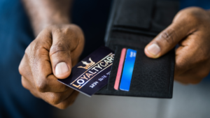Man takes customer loyalty card out of his wallet