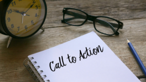 Notebook with words "call to action" written down sitting on a desk.