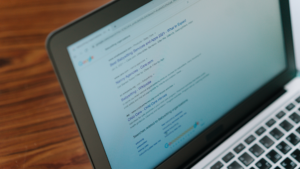 Laptop shows search results on Google with Google Ads.